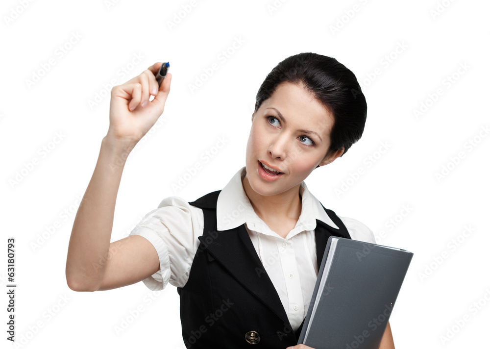 Pretty business woman writing on the invisible screen Pretty business woman writing on the invisible screen