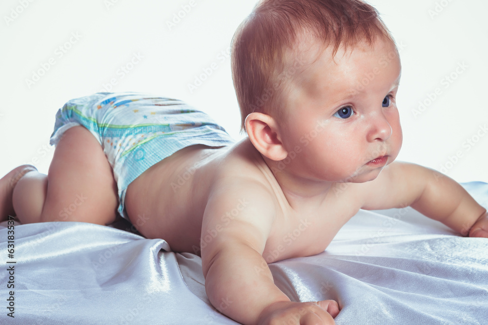 Beautiful blue-eyed baby in diapers Beautiful blue-eyed baby in diapers