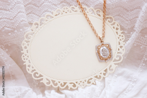 Baby white dress with golden icon for Christening