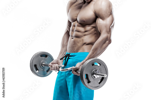 Muscular bodybuilder guy doing exercises with dumbbells over whi