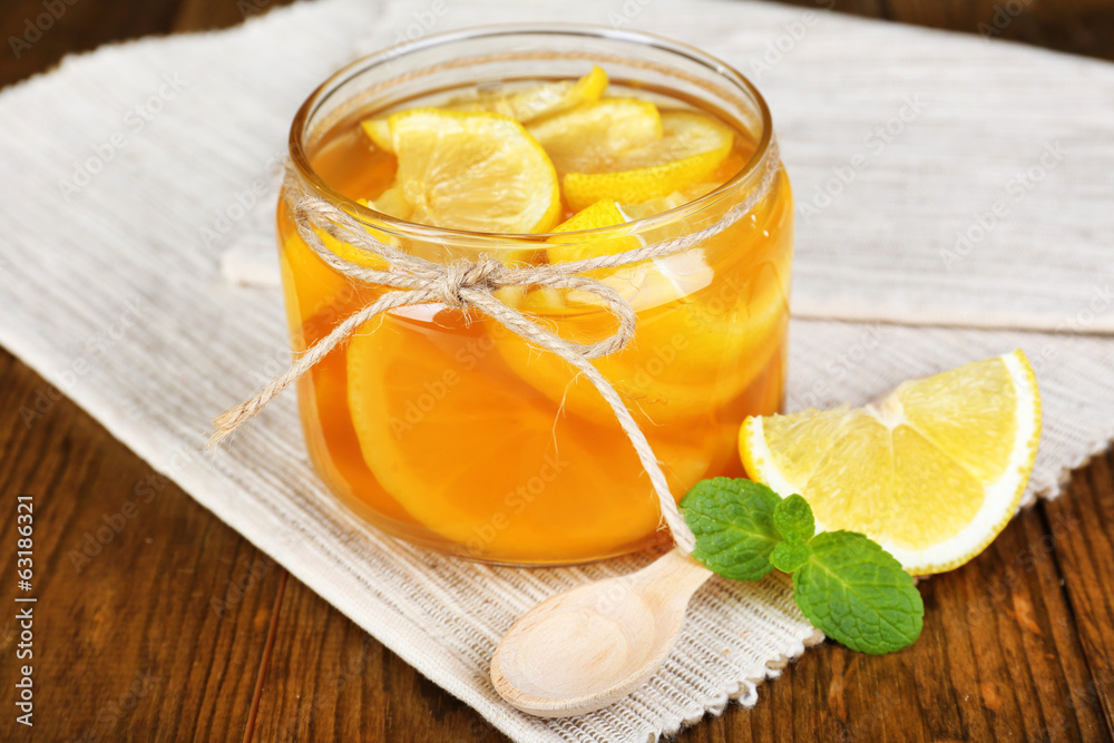 Fototapeta premium Tasty lemon jam on table close-up