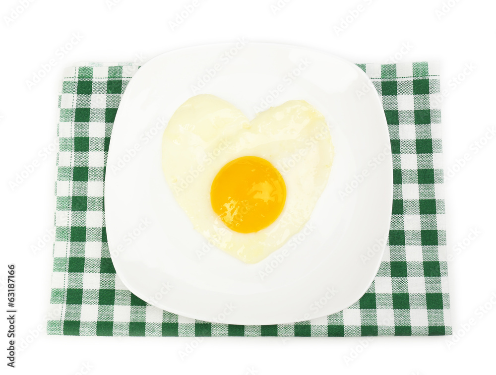 Scrambled eggs with bread on plate, on color napkin Scrambled eggs with bread on plate, on color napkin