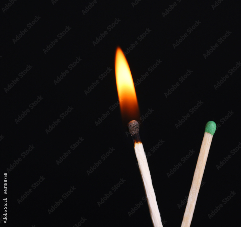 Burning match isolated on black Burning match isolated on black