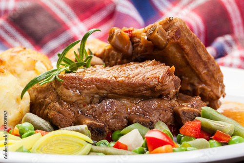 Pork spareribs served with mashed potatoes