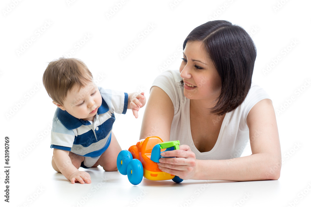 kid boy and mother playing together with toy