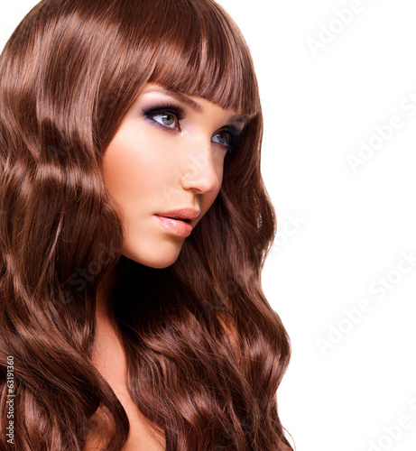 Profile portrait of beautiful woman with long red hairs