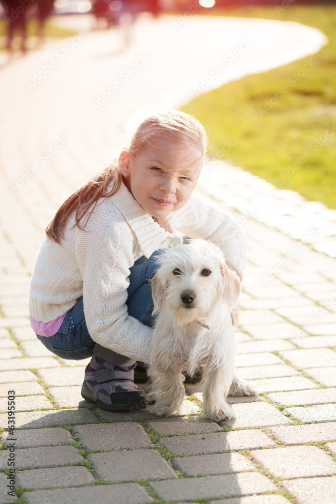 Little girl with her puppy dog