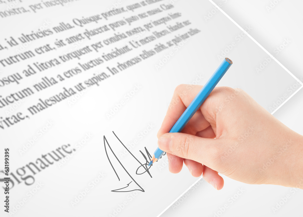 Hand writing personal signature on a paper form Hand writing personal signature on a paper form