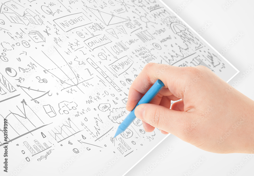 Human hand sketching ideas on a white paper Human hand sketching ideas on a white paper