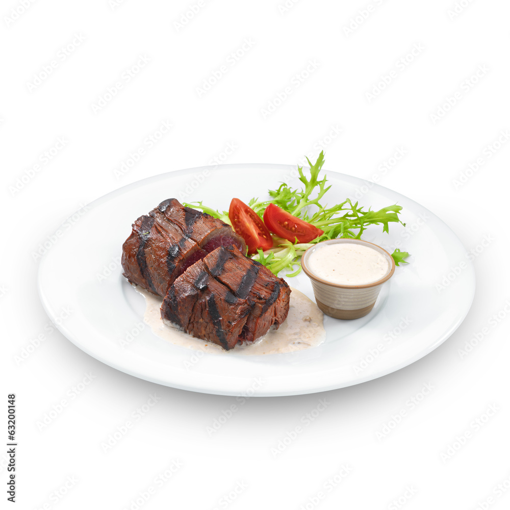 Delicious grilled tenderloin steak. Isolated on white Delicious grilled tenderloin steak. Isolated on white