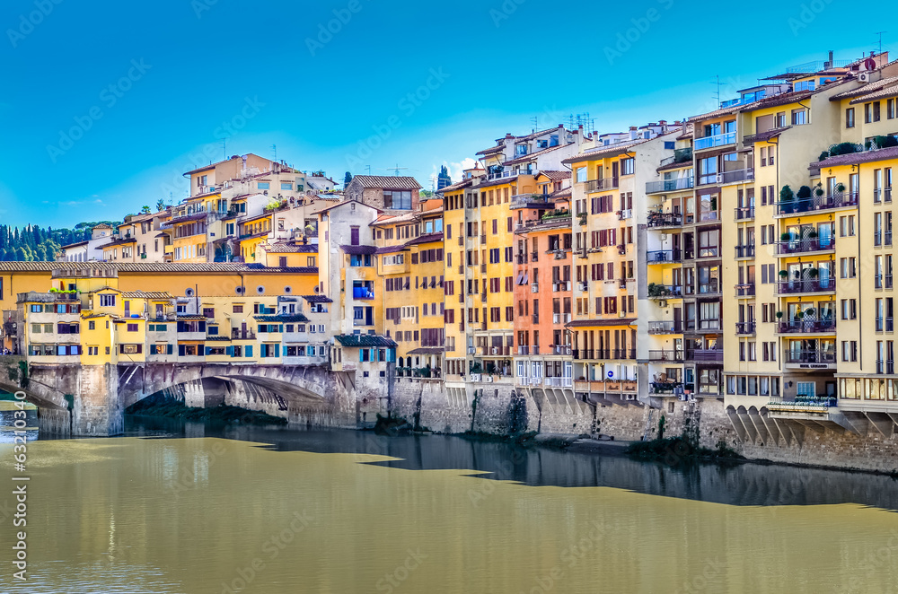 View of colorful houses and Ponte Vecchio bridge in Florence