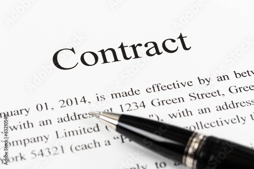 Business contract document with pen close-up © wirojsid
