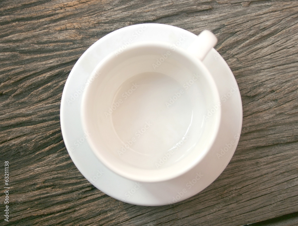 Empty coffee cup on old wooden table Empty coffee cup on old wooden table