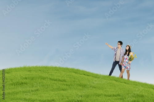 Couple walking on the field