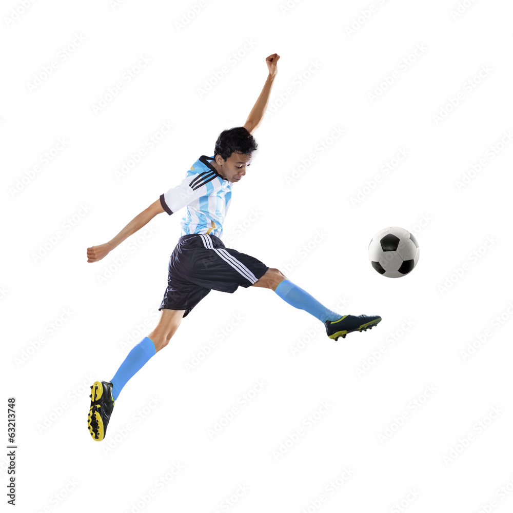 Football player kicking ball isolated Football player kicking ball isolated