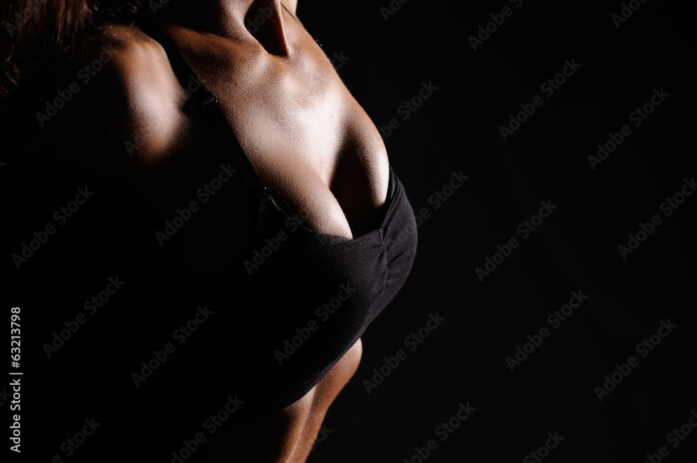 Naklejka premium Beautiful female body on a dark background