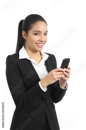 Arab business woman using a smart phone and looking at camera