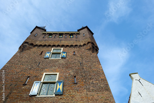 Old tower points into the sky in spring photo