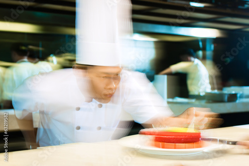 Asian chefs cooking in Restaurant