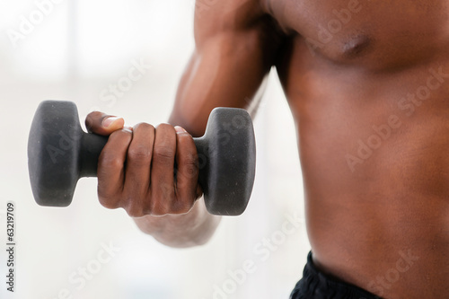Man training with dumbbells.