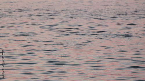 Pink and Blue water ripples at sunrise