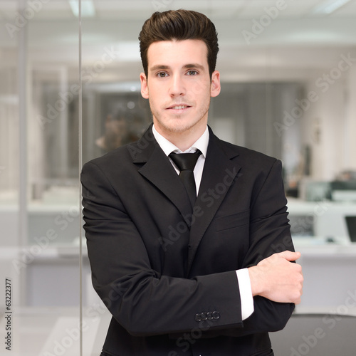 Handsome young businessman in an office