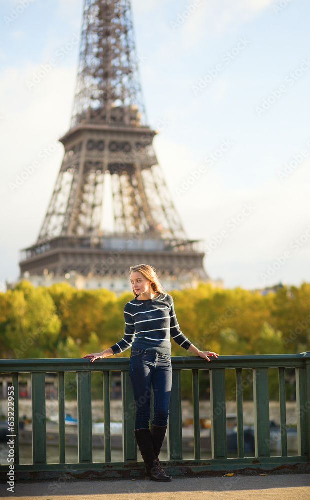 Beautiful young woman in Paris on a fall day