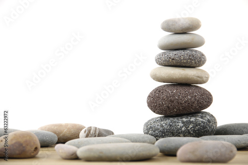 stacked stones on a wood board