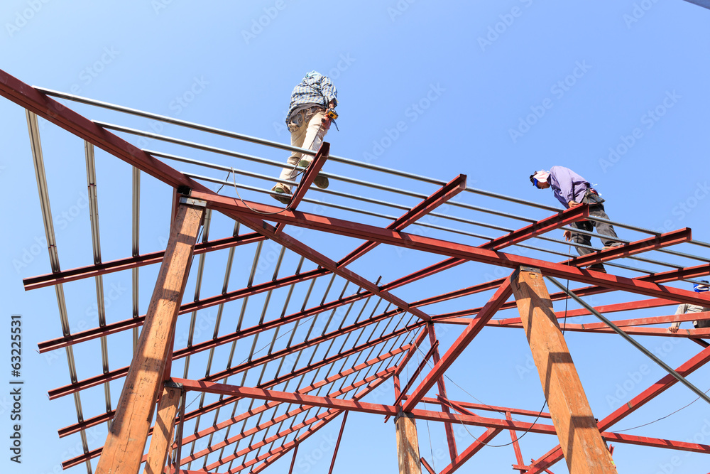 labor working in construction site for roof prepare