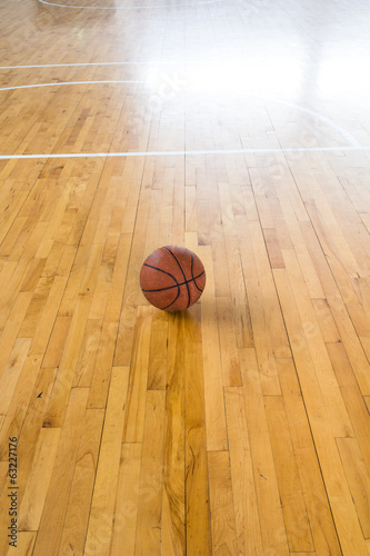 Basketball ball over floor in the gym © torsak
