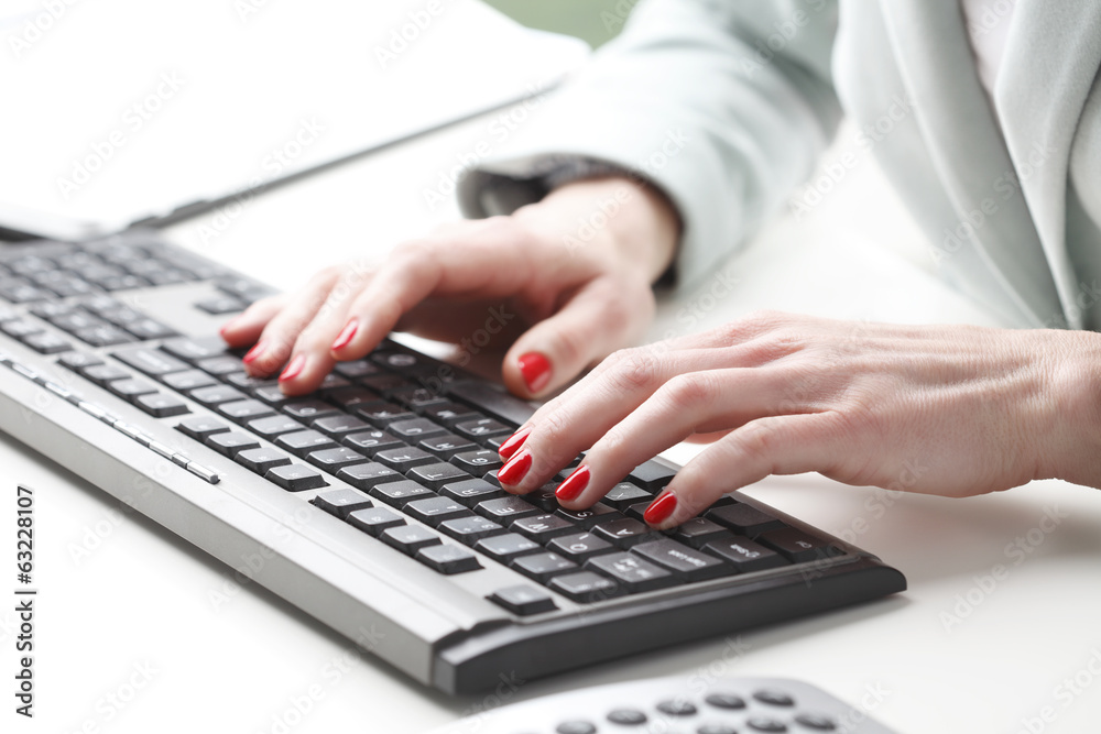 Businesswoman typing on keyboard Businesswoman typing on keyboard