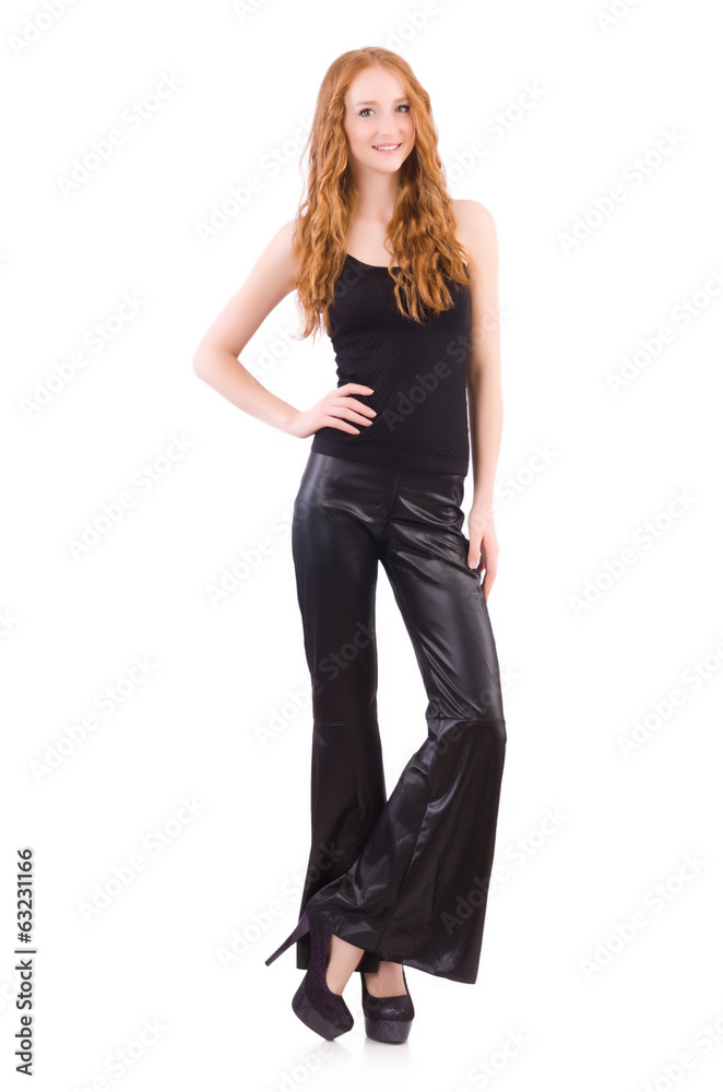 Redhead woman in black bell bottom pants on white Redhead woman in black bell bottom pants on white
