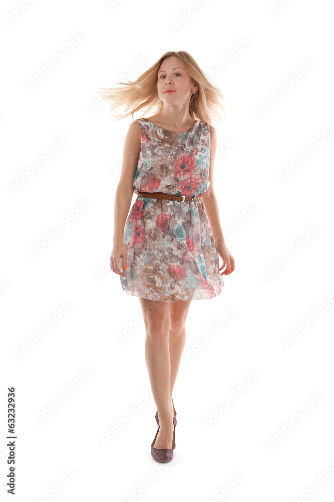 Young blond woman in a summer dress