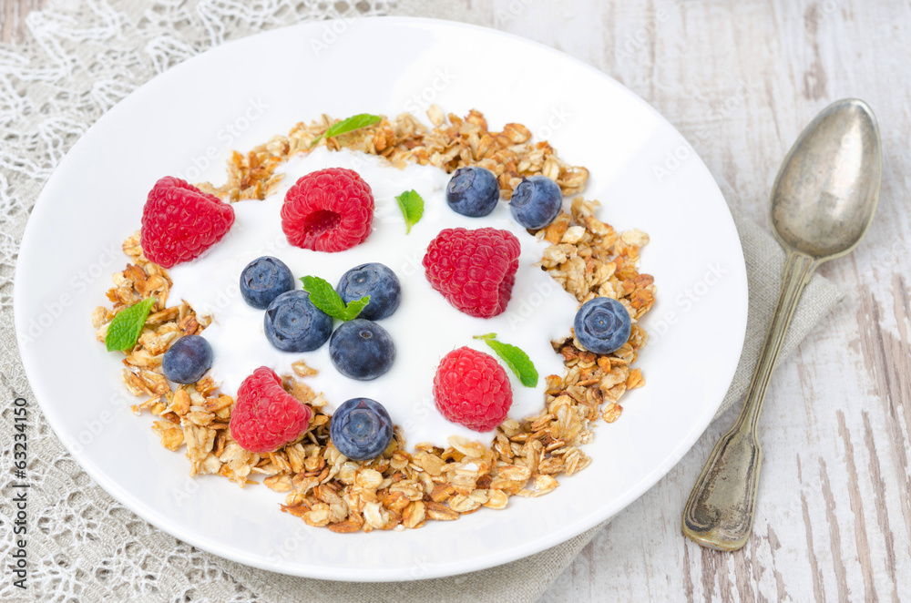 homemade granola with yogurt, raspberries and blueberries homemade granola with yogurt, raspberries and blueberries