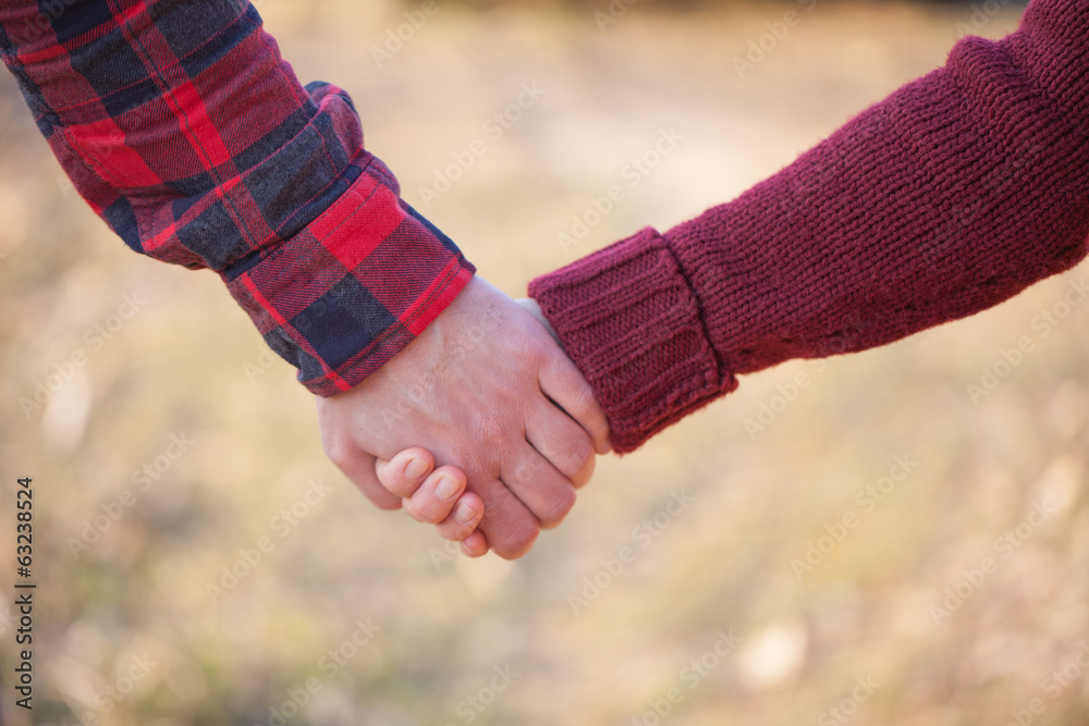 Romantic couple holding hands