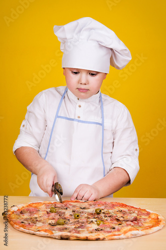Boy making pizza
