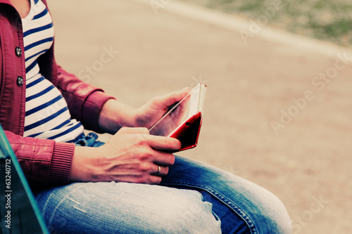 woman with tablet outdoors