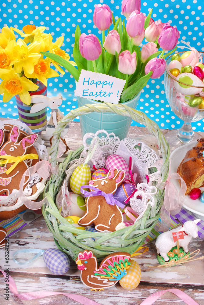 Naklejka premium easter basket with eggs,gingerbread bunny and fresh tulips