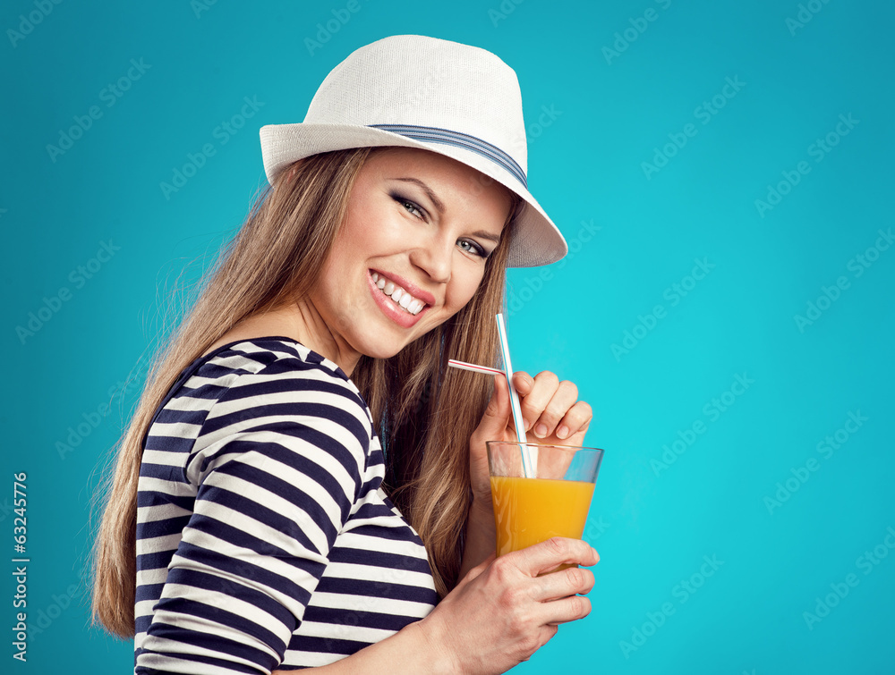 Active fresh summer girl drinking orange juice over blue Active fresh summer girl drinking orange juice over blue