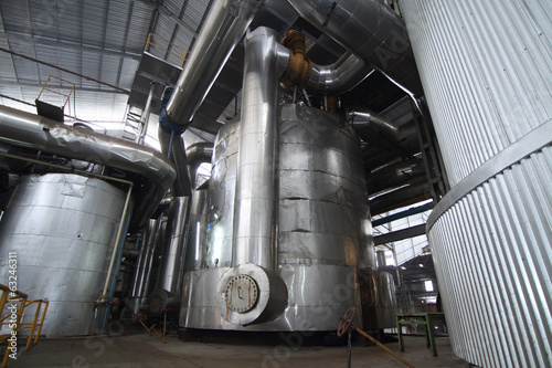 vacuum pans evaporator tanks in a sugar plant photo