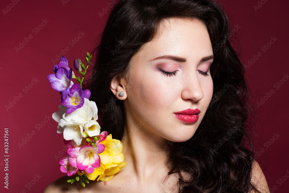 Pretty brunette lady with fresia flowers Pretty brunette lady with fresia flowers