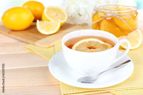 Tasty lemon jam on table close-up