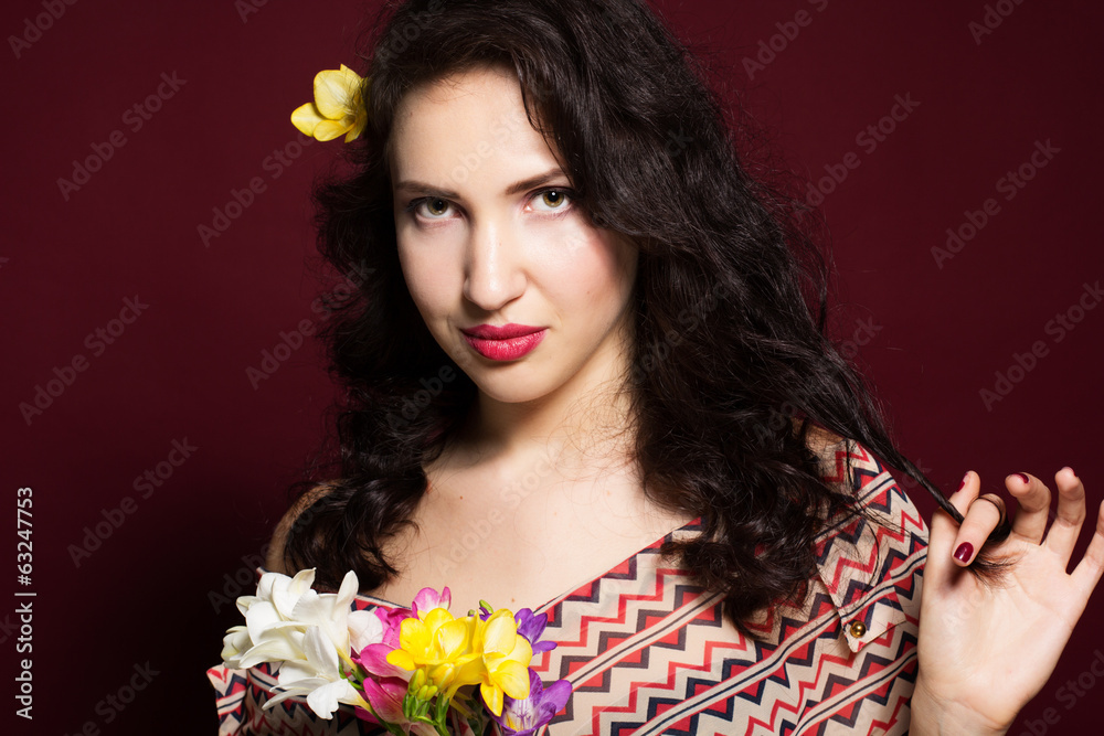 Fototapeta premium Pretty brunette lady with fresia flowers
