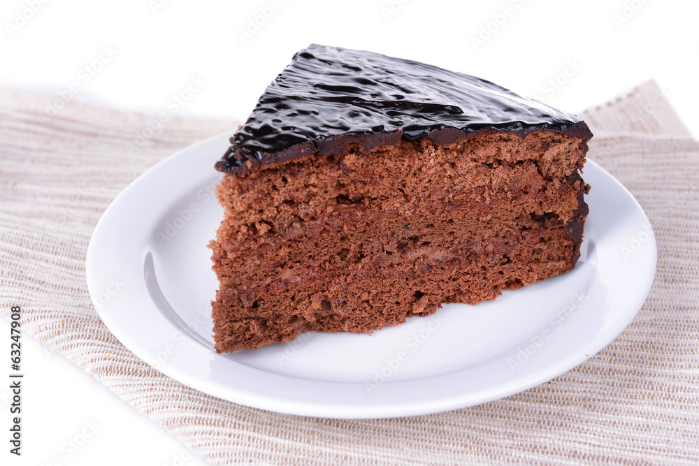 Delicious chocolate cake on plate on table close-up Delicious chocolate cake on plate on table close-up
