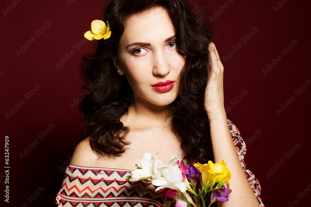 Fototapeta premium Pretty brunette lady with fresia flowers