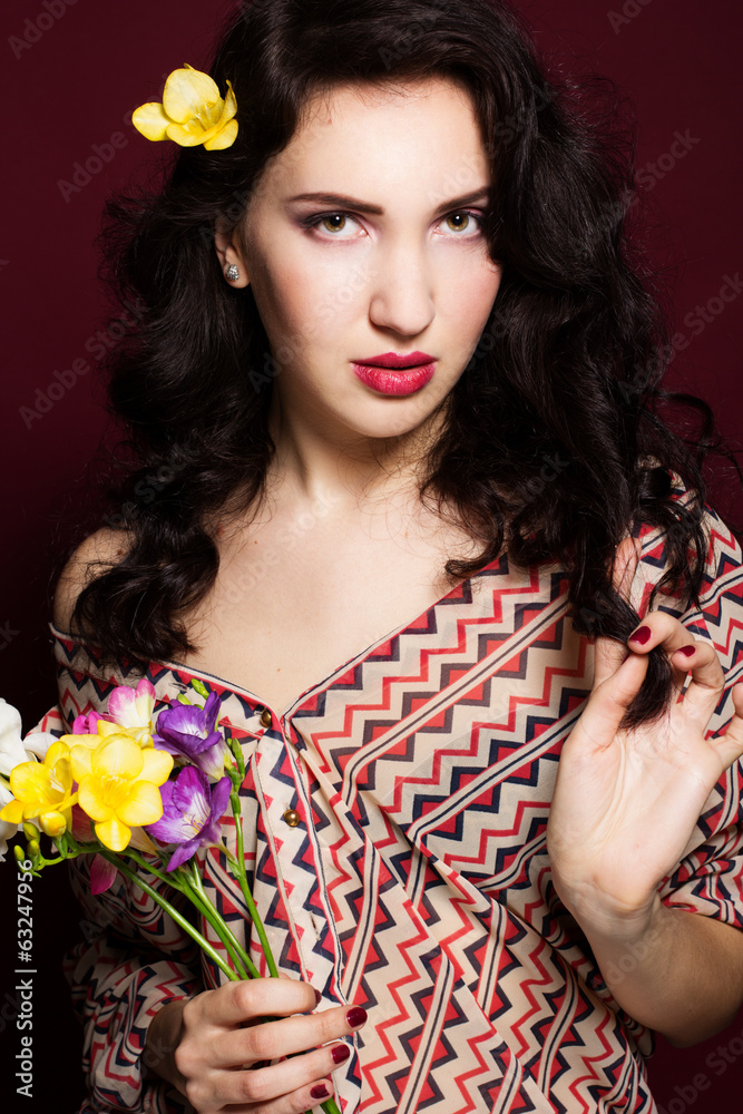 Fototapeta premium Pretty brunette lady with fresia flowers