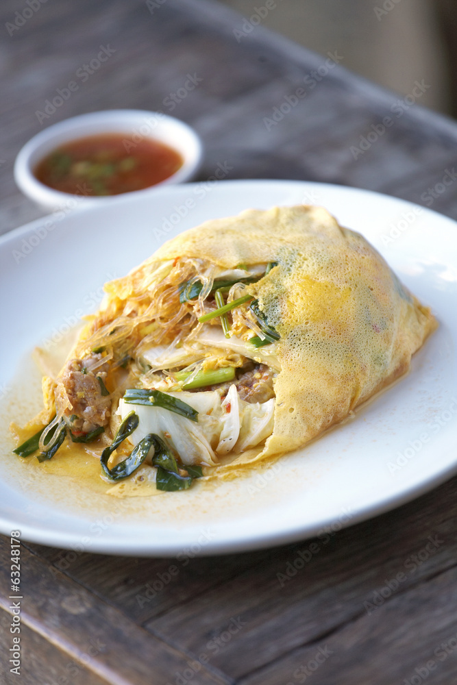 noodle and vegetable fried with egg in sun light noodle and vegetable fried with egg in sun light