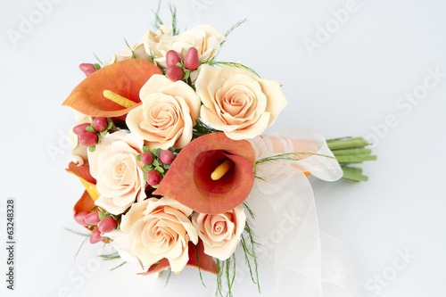 Fototapeta Naklejka Na Ścianę i Meble -  Colorful bouquet of orange calla lilies