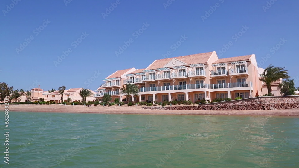 View of houses and hotels from boat floating on channels of El G View of houses and hotels from boat floating on channels of El G