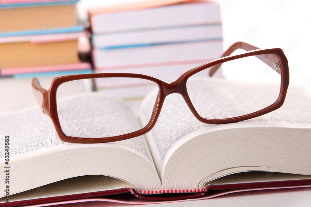 Composition with glasses and books, isolated on white Composition with glasses and books, isolated on white